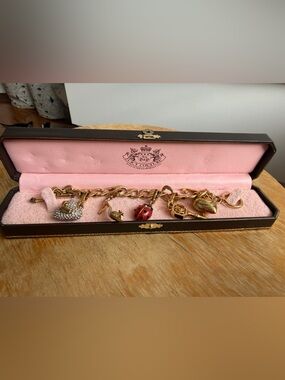 Juicy Couture Gold Tone Charm Bracelet with Red Ladybug and Crystal Accents